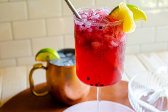 Blackberry Moscow mule in a clear glass.