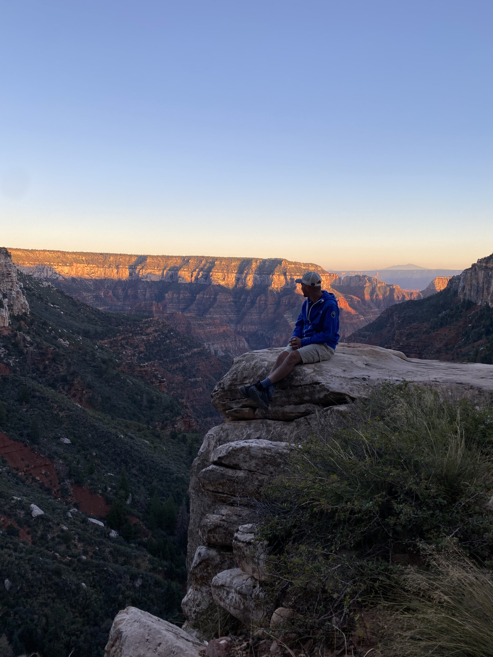 Man overlooking canyon.