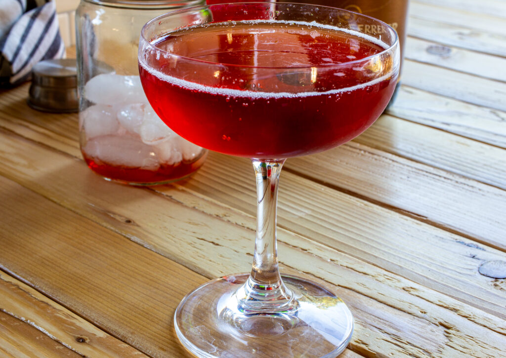 Sparkling boulevardier cocktail in a clear glass.