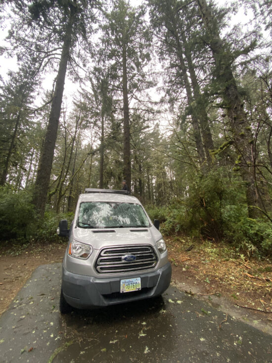 A van in the woods.